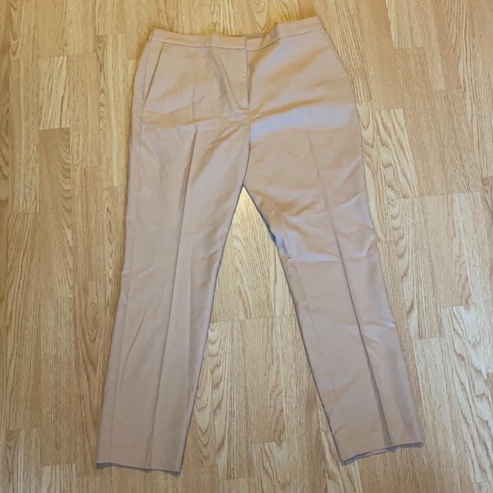 A salmon light pink, beige, professional khaki pants.